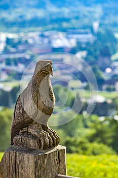 Wooden eagle craft on the fence at Maienfeld, Switzerland