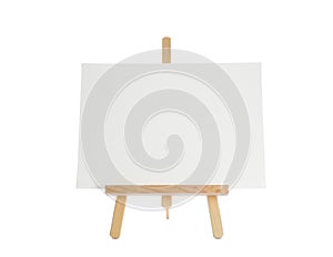 Wooden easel with blank sheet of paper