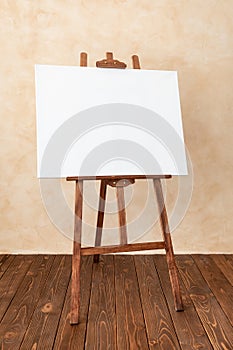 Wooden easel with canvas blank in studio
