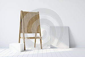 Wooden easel standing in an empty white room. 3d rendering