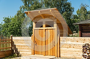 Wooden ecological toilet in the village. general sanitary unit