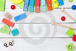 Wooden educational toys on a wooden background photo