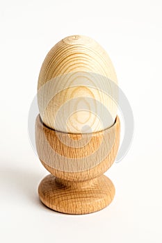 Wooden egg in the holder