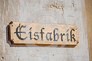 Wooden Eisfabrik or ice factory sign at ghost town Kolmanskop near Luderitz, Namibia, Southern Africa