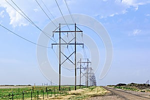 Wooden electic poles with a blue sky