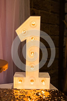 Wooden electric light up lamp alphabet in hard font. Number 1. Wooden number 1 with bulbs. First birthday