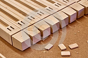 Wooden elements of a children`s bed. Furniture manufacture. Close-up