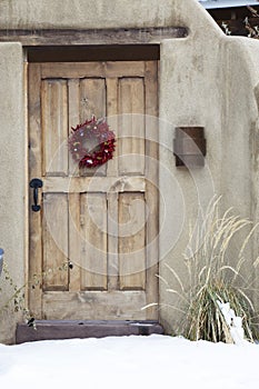 Wooden Entryway with Ristra Wreath in Santa Fe New Mexico