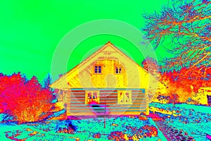 Wooden family house in infrared thermovision scan. Building warmth scale