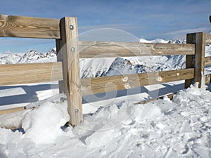 Wooden fance in Alps photo