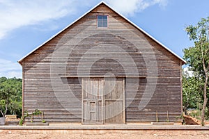 A wooden farm shed/ wooden barn and blue sky