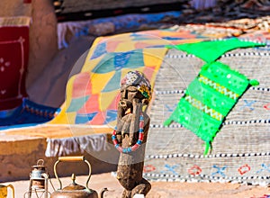 Wooden female figurine, Ait-Ben-Haddou, Morocco. With selective focus