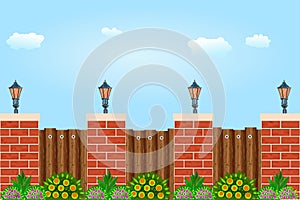 Wooden fence against the sky. Wooden fence with pillars of bricks, street lamps, green plants and blue sky. Red brick poles fence