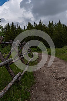 Wooden Fence Along Dirt Trail in Wyoming