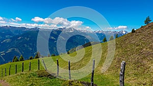 Gurglitzen - Wooden fence on alpine meadow with Panoramic view of mountain peaks of Karawanks and Julian Alps