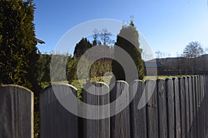 Wooden fence as demarcation to other land