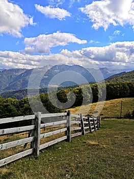 Wooden fence on the background of the mountain landscape