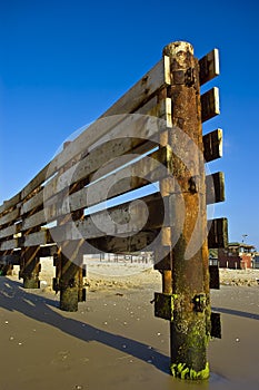 Wooden fence on beach