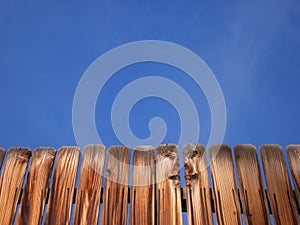 Wooden Fence and Blue Sky Background