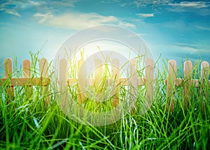 Wooden fence on blue sky background