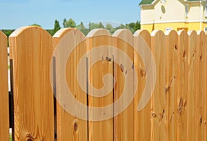 Wooden fence detail construction, Wooden house fencing. Close up on cozy wooden fence
