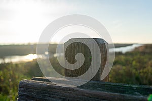 Wooden fence on a field / Sunset on the beach / sunset over the river