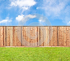 Wooden fence at the grass