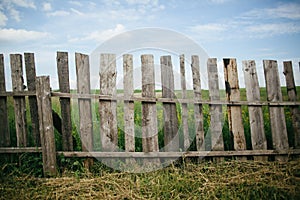 Wooden fence at the grass