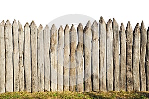 Wooden fence from logs isolated on white background. Fence from a stockade fence on white