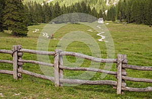 wooden fence long a mountain pasture in Val Gardena