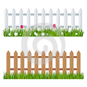 Wooden fence near flower bed
