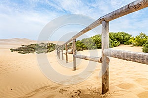 Wooden fence in the Sand dunes at Pismo beach in California, USA