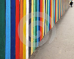 Wooden fence on sidewalk