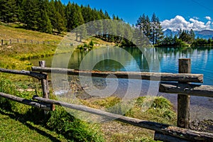 Wooden fence surrounding the Lake of Joux in Vens, Val Aoste, Italy