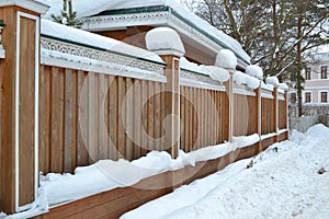 Wooden fence with wood carving