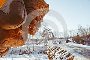 wooden figure on the bow of the ship