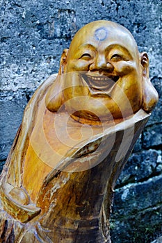 A wooden figure of buddha