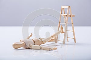 Wooden Figure Lying On Floor