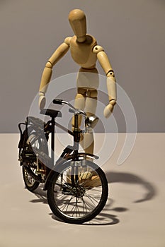 Wooden Figure mannequin and bicycle
