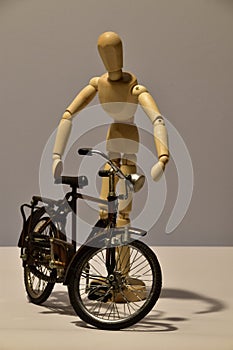 Wooden Figure mannequin and bicycle