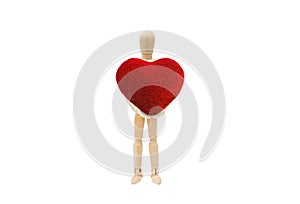 Wooden figure mannequin holding red heart shape isolated on white background.