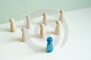 Wooden figure on wooden desk. Business leadership teamwork concept