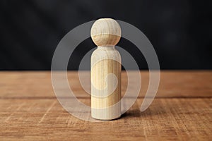 Wooden figure on a wooden table