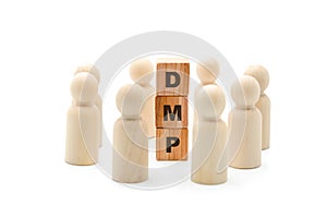 Wooden figures as business team in circle around acronym DMP Data Management Platform