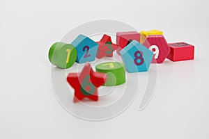 Wooden figures with numbers 1, 2, 3, 4, 5, 6, 7, 8, 9 and 10. Wooden cubes with numbers for children