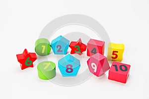 Wooden figures with numbers 1, 2, 3, 4, 5, 6, 7, 8, 9 and 10. Wooden cubes with numbers for children