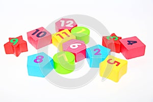 Wooden figures with numbers 1, 2, 3, 4, 5, 6, 7, 8, 9 and 10. Wooden cubes with numbers for children
