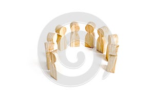 Wooden figures of people stand on a white background. Communication. Business team, teamwork, team spirit. Wooden figures