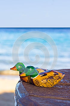 Wooden figurines mandarin duck. symbol love