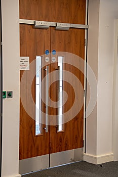 Wooden fire exit door in an office building